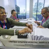 Election officials warn that widespread problems with the US mail system could disrupt voting
