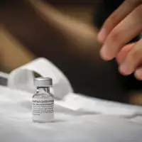 Alberta government to start charging residents for COVID-19 shots this fall