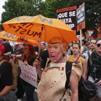 Military parade set to kick off in nation's capital as protesters around the country decry Trump