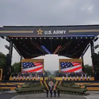 Military parade rolls through DC as 'No Kings' protesters across US decry Trump