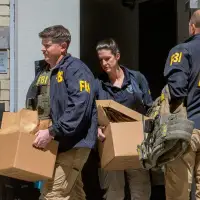 Photos of FBI searching the home and office of John Bolton, a former Trump ally turned critic