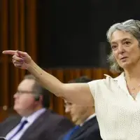 'Who let her in??!' Minister's staff accidentally text deliberations about 15 per cent spending cut to reporter