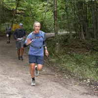Carney surprises many with appearance at long-distance trail race