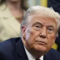 Trump says he would have lowered flags for Minnesota slayings if asked. But he didn't call governor