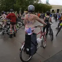 Naked bike riders demonstrate against federal troops in 'quintessentially Portland' protest