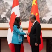 In Beijing, Anand signals warming relationship with China