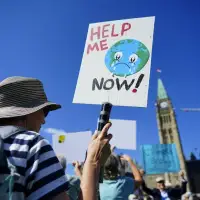 Climate activists award Canada satirical 'fossil of the day' title at COP30