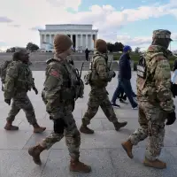 US halts all asylum decisions as suspect in shooting of National Guard members faces murder charge