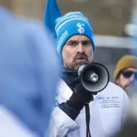 Scientists rally against coming job cuts as notices hit desks across the public service