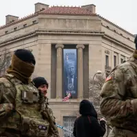 Large banner featuring Trump's face is displayed on Justice Department headquarters