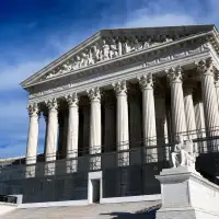 The Latest: Trump says he's enacted a 10% global tariff by executive order