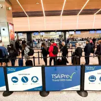 The Latest: Over 450 TSA officers have quit since the partial shutdown began