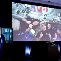 Carney praises Hansen, calls hearing French from space a point of pride