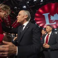 Carney issues call for unity, says no time for 'politics as usual'