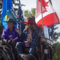 Canada, Alberta flags fly high at town parade during separatism debate