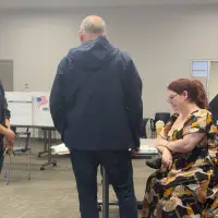 Election worker says federal officers confronted her at polls over social media post criticizing ICE