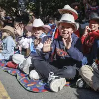 Cheers and jeers: Alberta Premier rolls through Calgary in Stampede parade