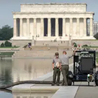 Crews are draining the Lincoln Memorial Reflecting Pool again as part of Trump's troubled revamp