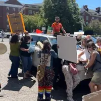 Protesters surround Tim Houston's car, windshield smashed after speech