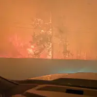 'Like doomsday': Thousands flee explosive B.C. wildfire as RCMP report possible death