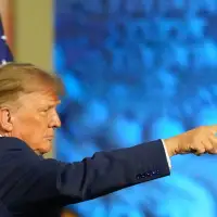 The Latest: Trump centers himself in pitch to midterm voters, promising payouts if the GOP wins