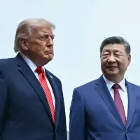 The Latest: China's Xi to kick off visit to Washington with a rare planeside welcome from Trump
