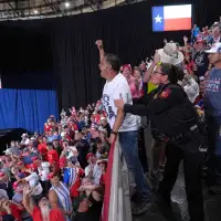 Trump interrupted by protesters as he fights to rally Texas voters behind Paxton in US Senate race