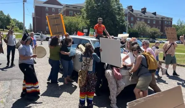 Protesters surround Tim Houston's car, windshield smashed after speech
